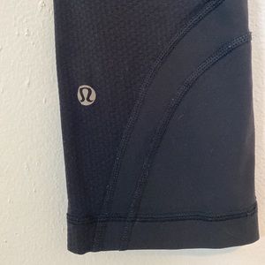 Used Lululemon size 8 black mid calf tights.